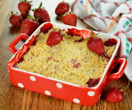 strawberry crumble on a brown tableの写真素材