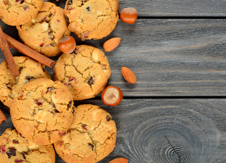 Cookies, spices and nuts on a gray background