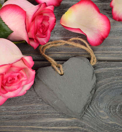 Heart and roses on a gray backgroundの写真素材