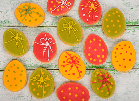 Easter cookies decorated with icing on white background