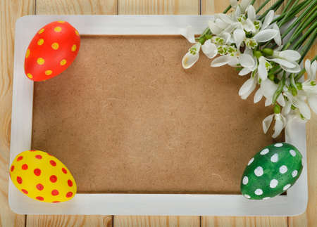 Easter background, eggs and white flowers