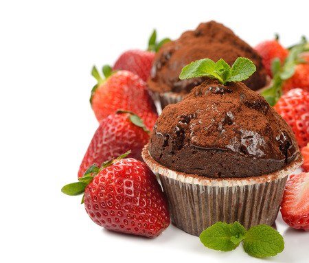 Chocolate cupcakes with strawberries on white backgroundの写真素材