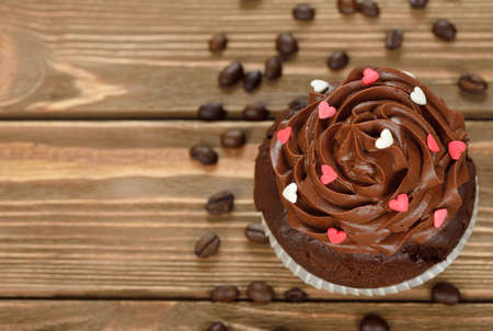 Chocolate cupcakes on a brown background