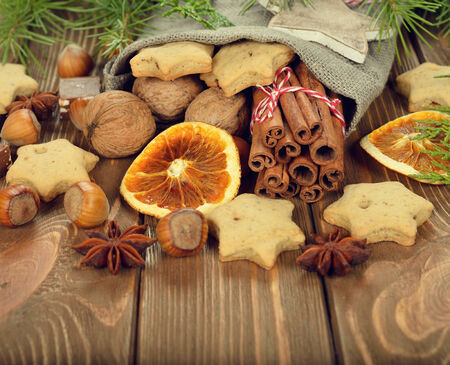 Christmas ingredients and cookies on brown backgroundの写真素材