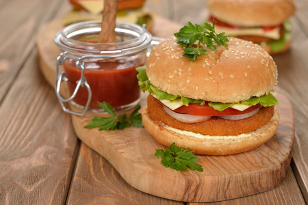 Fresh cheeseburger on a brown backgroundの写真素材