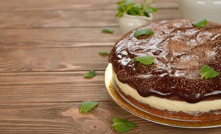 Chocolate cake on a brown background