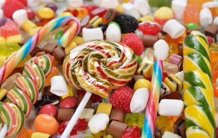 Colorful lollipop and candy on a white background