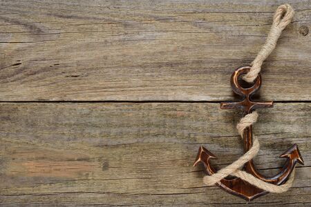 Vintage anchor on a wooden backgroundの写真素材