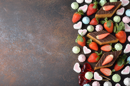Various festive sweets on brown backgroundの写真素材