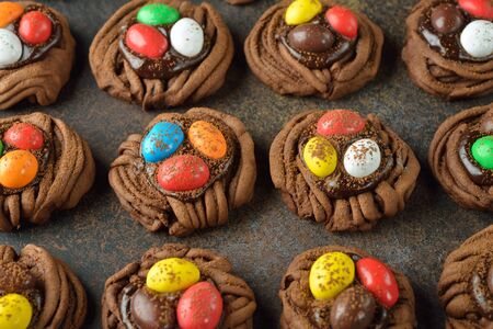 Cookies chocolate Easter nest on a brown backgroundの写真素材