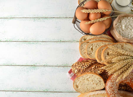 Various bread and wheat on white background, rustic food conceptの写真素材