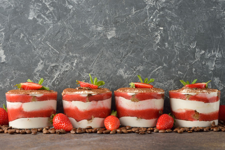 Strawberry dessert tiramisu on a brown backgroundの写真素材