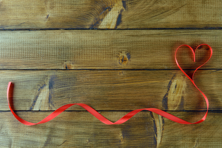 Red decorative heart on a brown backgroundの写真素材