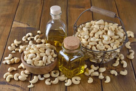 Natural organic cashew oil on a brown backgroundの写真素材