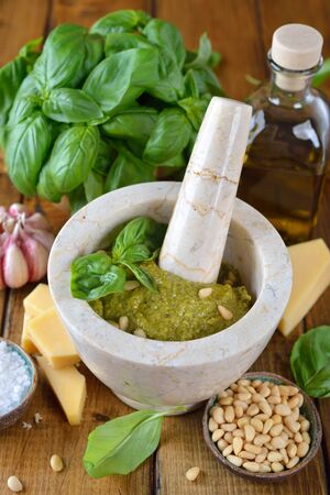 Pesto sauce on a brown backgroundの写真素材