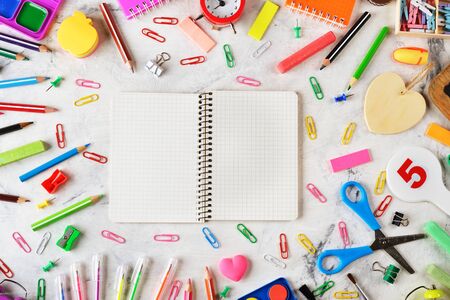 Colorful school supplies on a white background