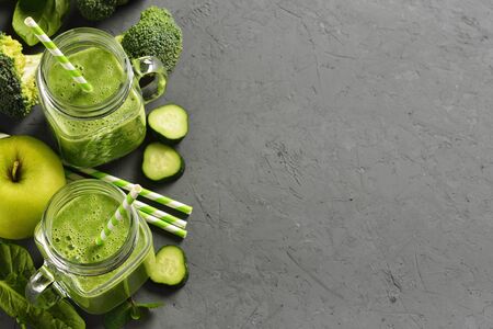 Green smoothie on a gray backgroundの写真素材