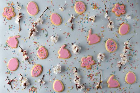 Easter sweets and decorations on a gray background