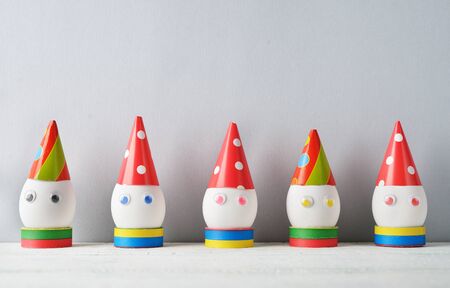 Funny easter eggs on gray background