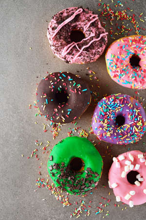 Fresh sweet donuts on gray backgroundの写真素材