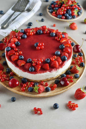 Summer cheesecake with berries on a gray backgroundの写真素材
