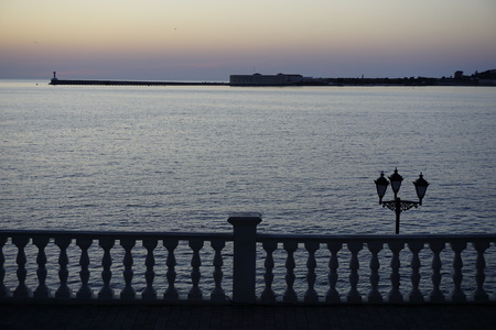 Sevastopol, Crimea, Russia. Well-known historical place in city center, street lanterns and night  illumination reflected in Black Sea at sunset todayの写真素材