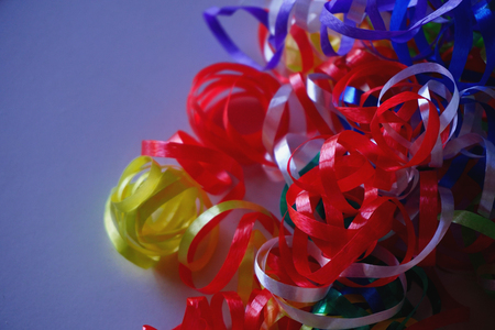 Tinsel, stripes isolated. Colorful ribbons, decorations for holiday. Useful background. Colors: red, green, yellow, violet, blueの写真素材