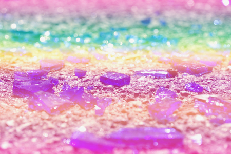 Fragments of colorful glass lie on the asphalt. Photo colors: blue, yellow, lilac, purple, purple. Broken bottle.の写真素材
