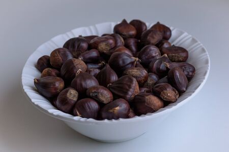 Chestnut fruits on light background selective focusの写真素材