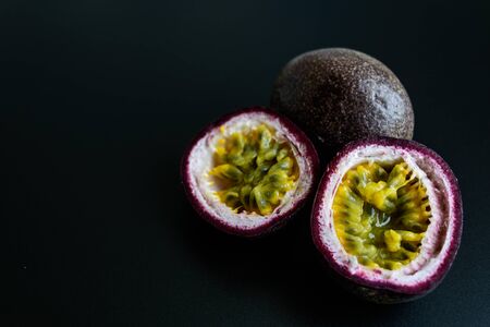 Passion fruit on dark backgroundの写真素材