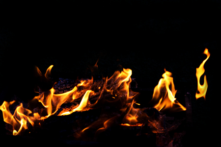 Fire flames on dark backgroundの写真素材
