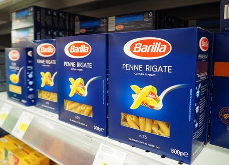 Saint-Petersburg, Russia. May 10, 2019. Barilla Penne Rigate Italian pasta on the supermarket shelves. Barilla is an Italian food company founded in 1877 in Parma, Italy.のeditorial素材