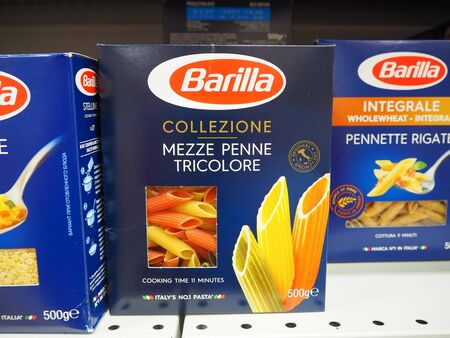 St. Petersburg, Russia. 07.21.2019. Barilla Mezze Penne Tricolore italian pasta on the supermarket...