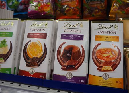 St.Petersburg, Russia. 07.30.2019. Lindt Creation assorted chocolate bars on the supermarket shelf. Lindt is a Swiss chocolatier and confectionery company known for its chocolate truffles and chocolate barsのeditorial素材