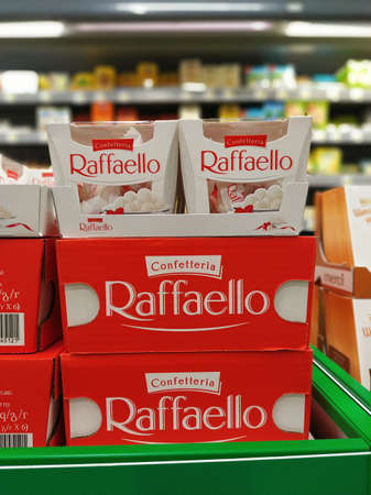 Raffaello coconut almond candy collection on a supermarket shelf. Confectionery by the Italian chocolatier Ferrero. St. Petersburg, Russia. 2020-02-20.のeditorial素材