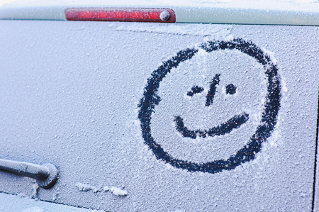 Drawing on the rear window of a car made by handの写真素材