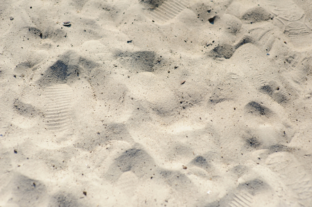 Footprints in the sand. Texture of sand and footprints in the sandの写真素材