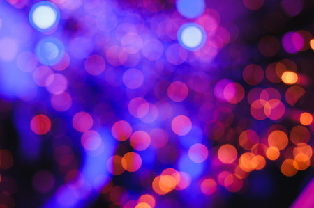 Defocused lights. Colored abstract blurred light background. Concept or festival background. Natural...
