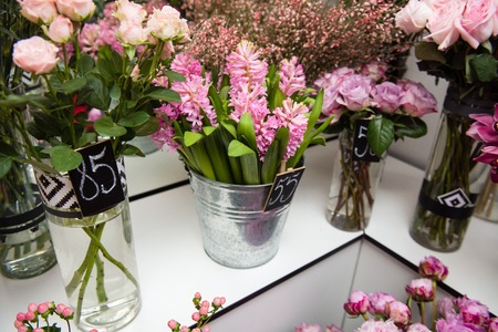 Flower bouquets in vases at store indoorsの写真素材