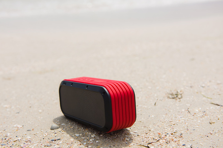 Red small portable speaker outdoorsの写真素材
