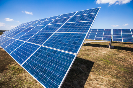 Solar power plants, photovoltaic panels arranged in a variety of scenesの写真素材