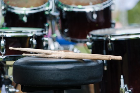 Vintage wooden drumsticks close up at chair