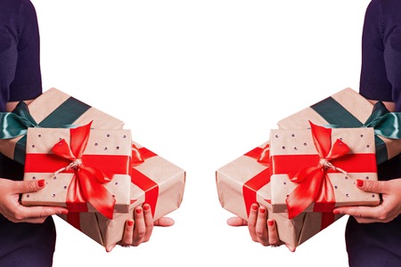 Female hands with gifts studio mirror imageの写真素材