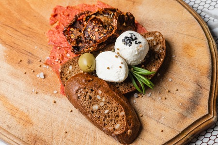 Arabic cheese balls with spices Rosemary, Nigella, Kalindzhi, Sumy, Garam Masala on wooden deskの写真素材