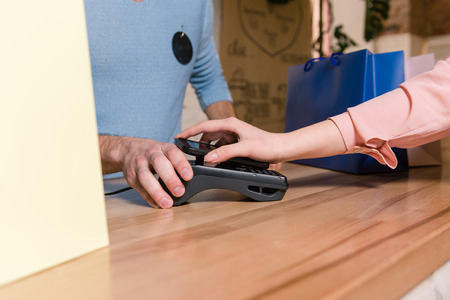 Payment by terminal and mobile bank application.の写真素材