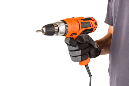 Man wearing protective gloves, holding new electric automatic screwdriver at white isolated studio...