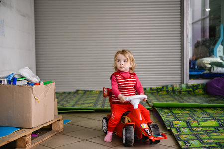 Dnipro, Ukraine - April 04, 2022: A little girl plays in a Refugee Assistance Center in Dnipro.のeditorial素材