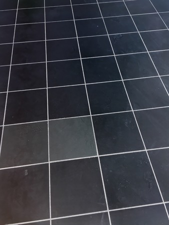 Black tiled floor backgroundの写真素材