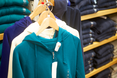 fashion woman s  sweats hoodie hanging in trendy boutiqueの写真素材
