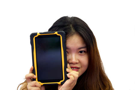 Beautiful asian girl holding a tablet in hands